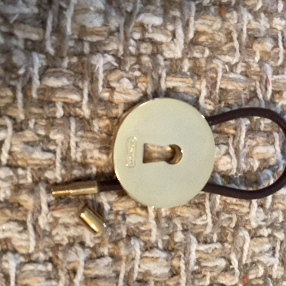 Coach gold tone round key ring with brown closer for adding keys securely. - Picture 3 of 5